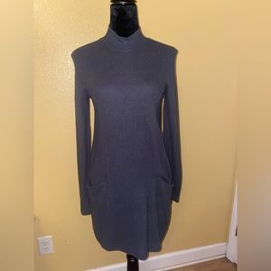 Grey long sleeve dress. Soft material. Has pockets.